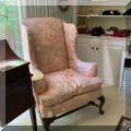 F49. Floral wing chair. 46"h x 32"w x 30"d 